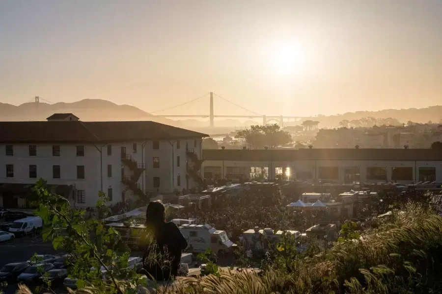 View of Fort Mason and the Golden Gate Bridge at sunset.