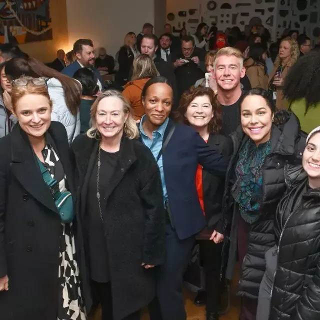 Staff and members gather at an official San Francisco Travel event.